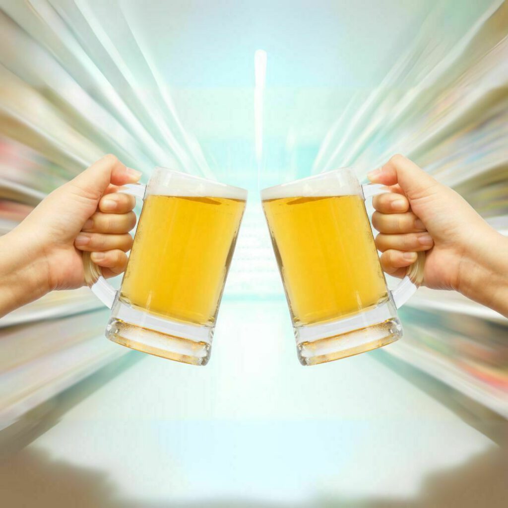 Two frosty mugs of beer clinking in a toast