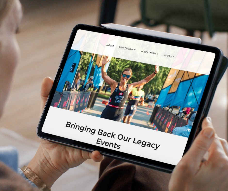 Hands holding a tablet showing the Apple Race Series website with a triathlete crossing the finish line