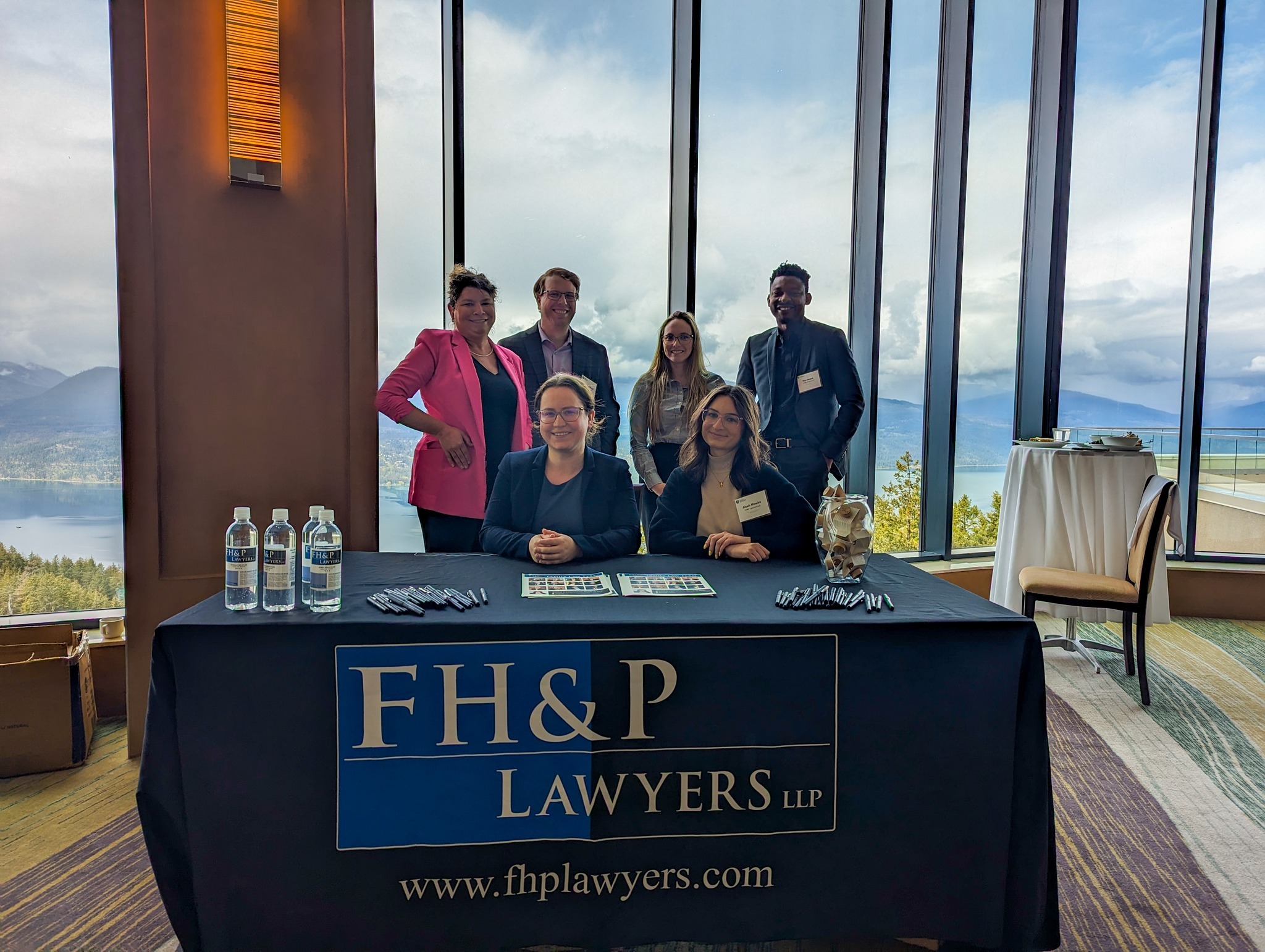 Lawyers staffing a booth at a community event