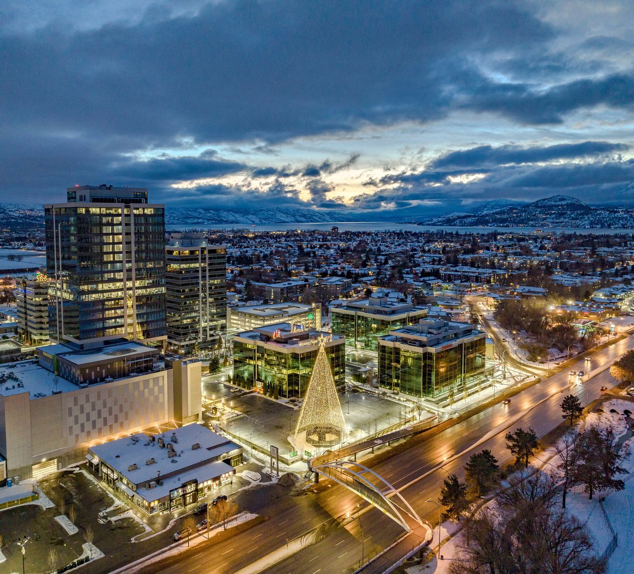 Downtown Kelowna at dusk, lit up for the holidays