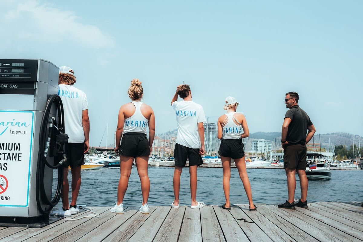 Kelowna Downtown Marina staff standing on the dock facing the marina