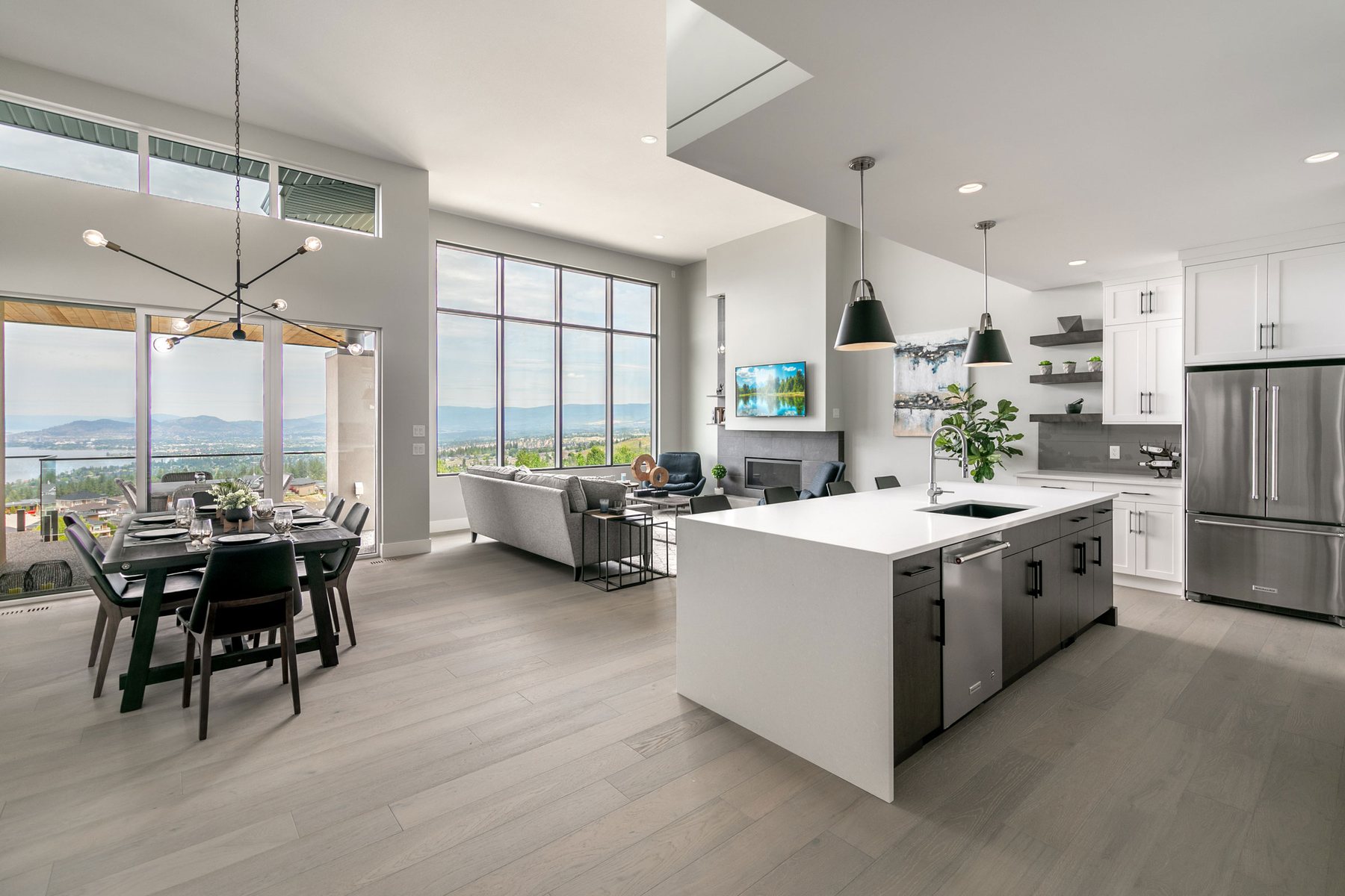 Bright open-plan kitchen and dining area with lake views at Kestrel Ridge