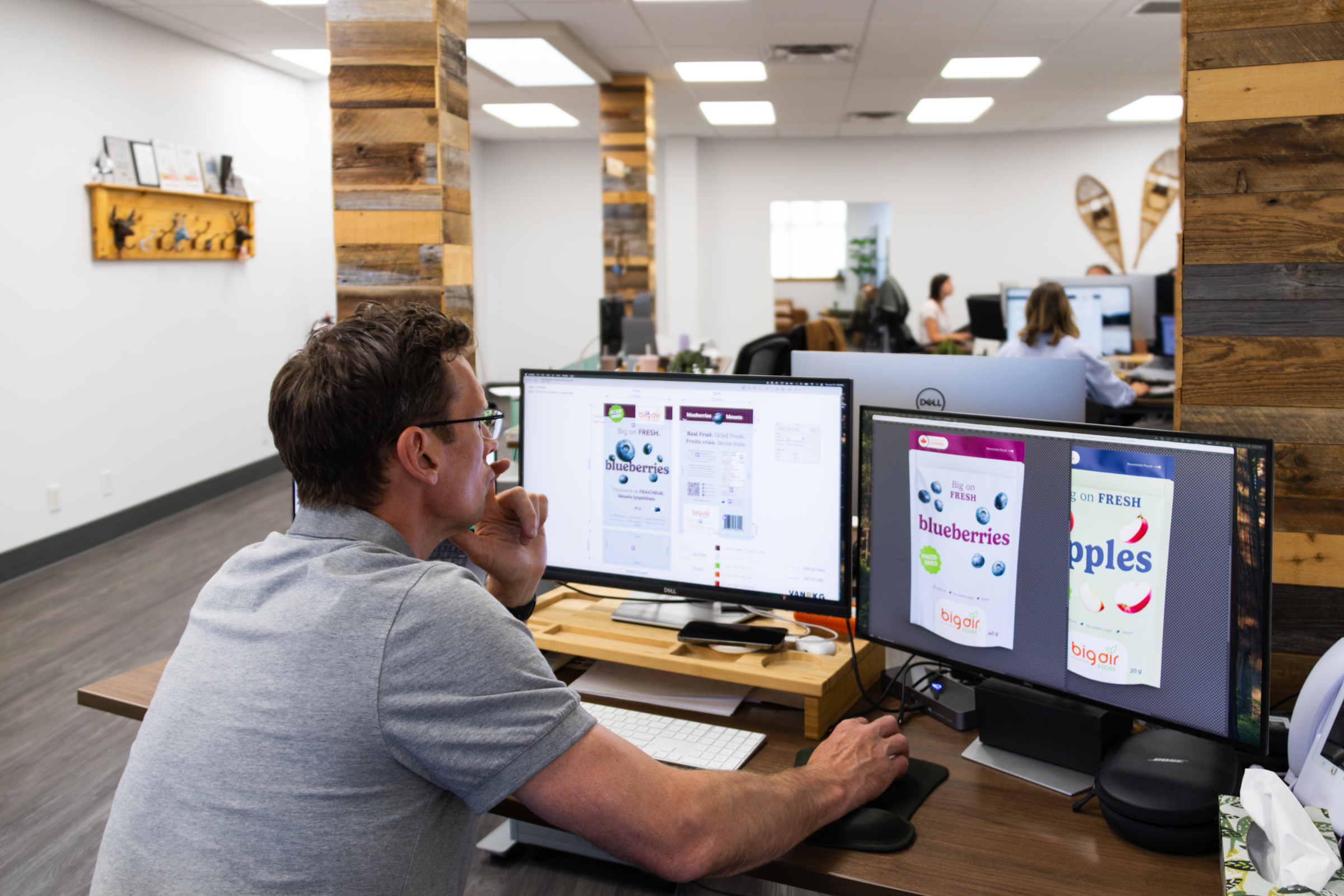 A Twin Creek designer working on packaging design in the office